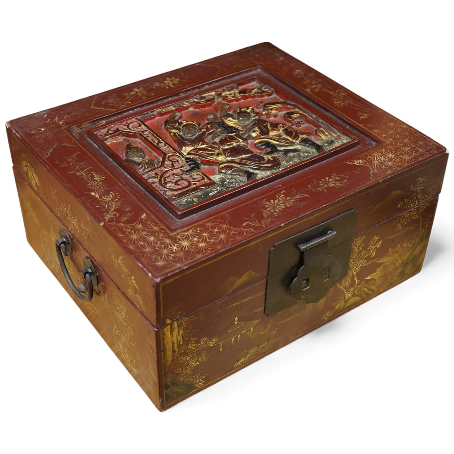 A Chinese lacquered box decorated with relief figures, 33cm wide